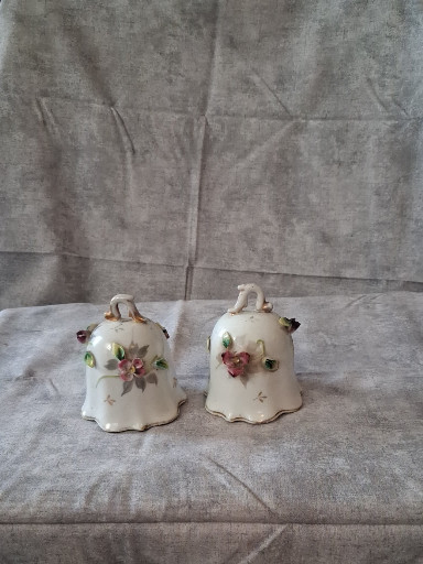 Pair of porcelain bells with applied floral decoration