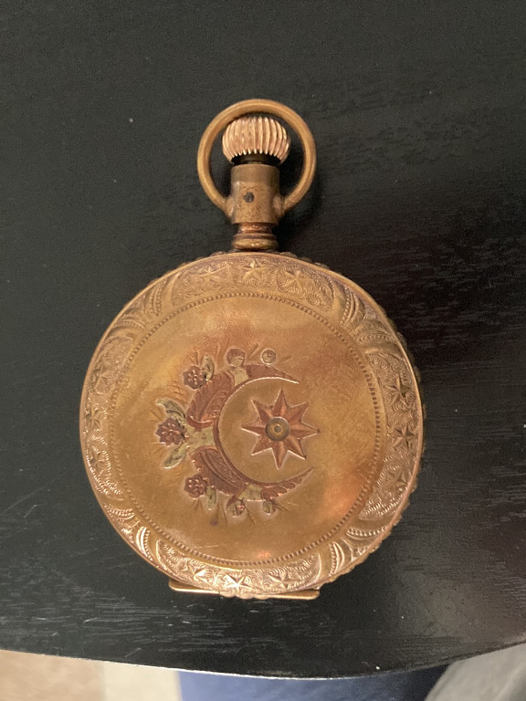 Gold-filled pocket watch with engraved crescent moon and star motif, American Waltham Watch Company