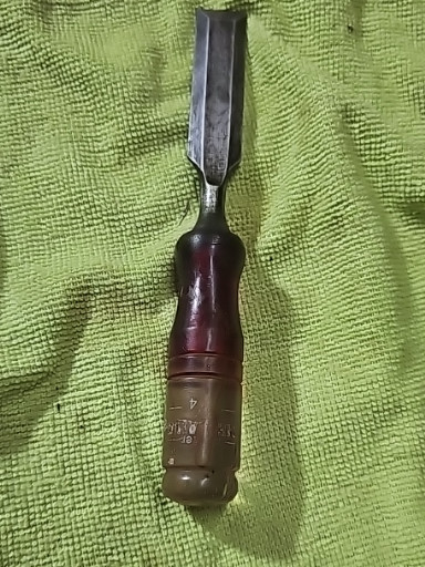 Vintage wood chisel with plastic handle, likely manufactured by Ace Hardware or similar hardware store brand