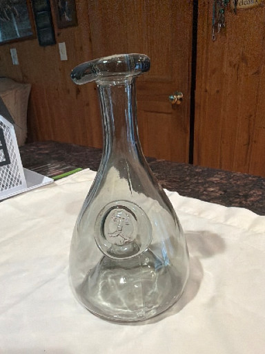 Clear glass decanter with embossed medallion, attributed to Holmegaard Denmark
