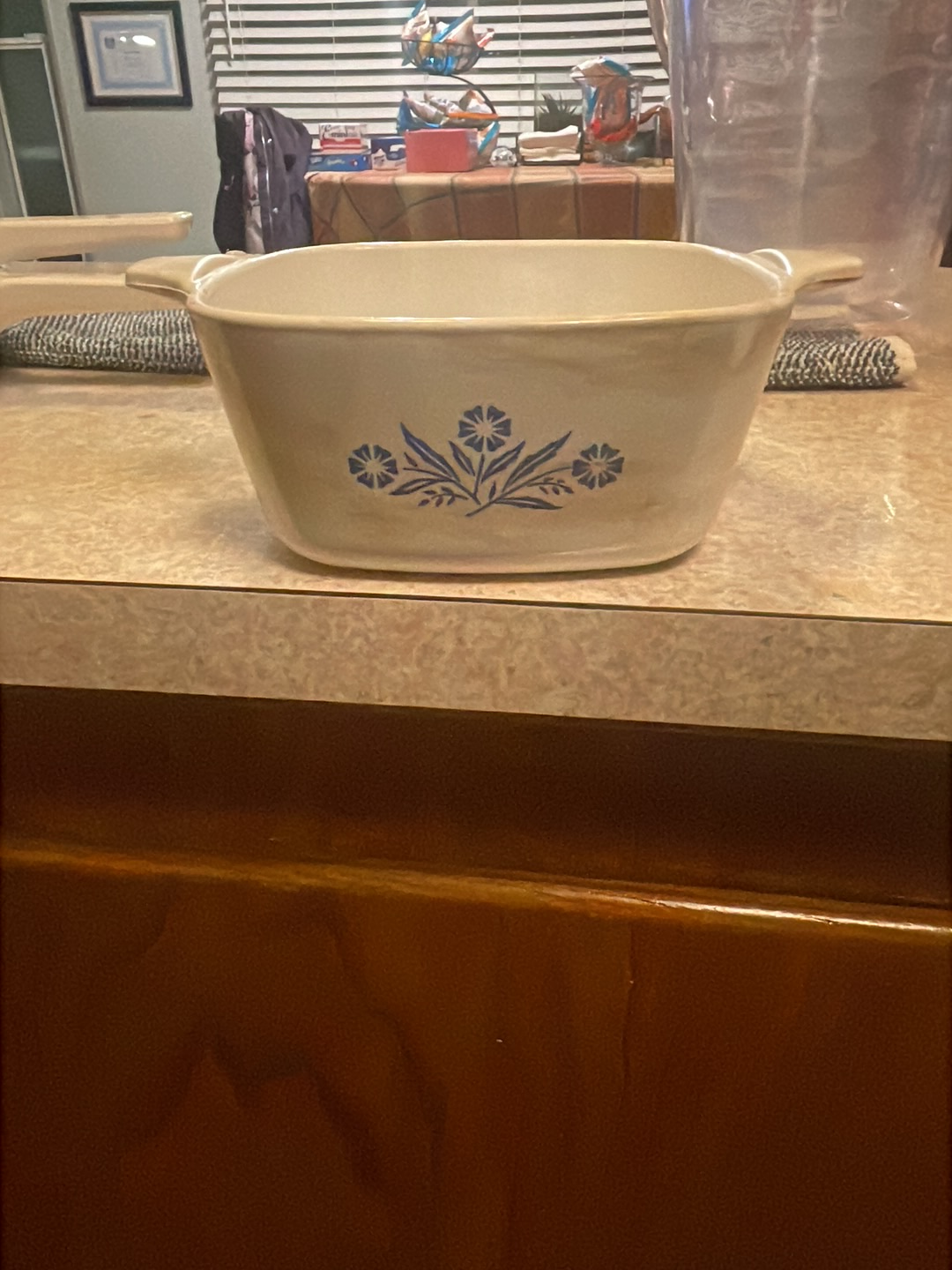 Ceramic casserole dish with blue cornflower pattern by Corning Ware