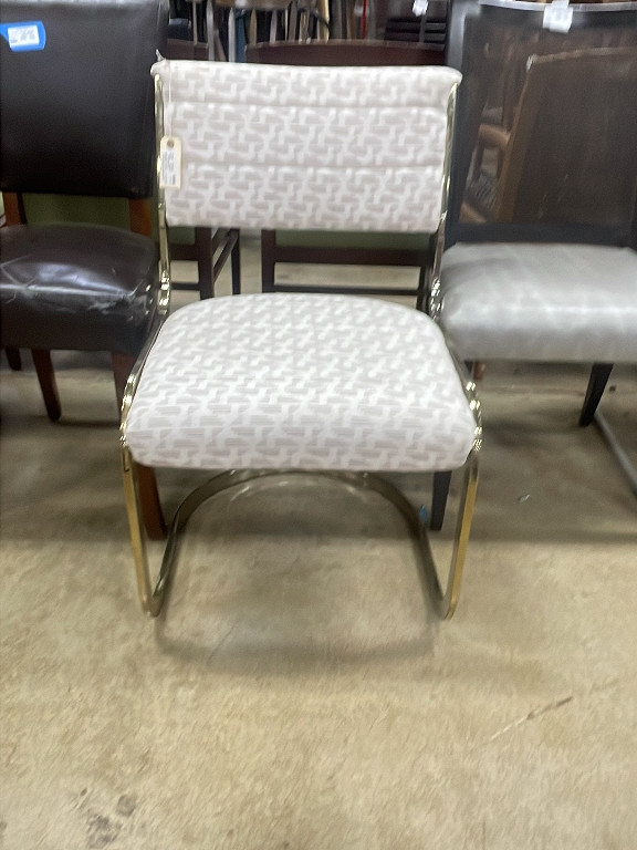 Brass-plated cantilevered chair with geometric upholstery by Steelcase