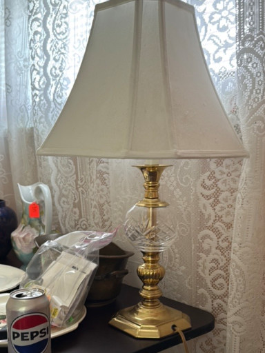 Brass table lamp with glass column and fabric shade