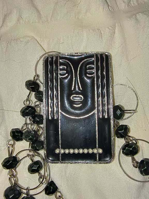 Pewter and black enamel Art Deco brooch/pendant by Charles of the Ritz
