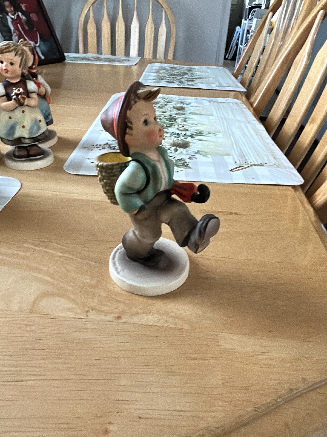 Porcelain figurine titled 'Globe Trotter' by Goebel Hummel