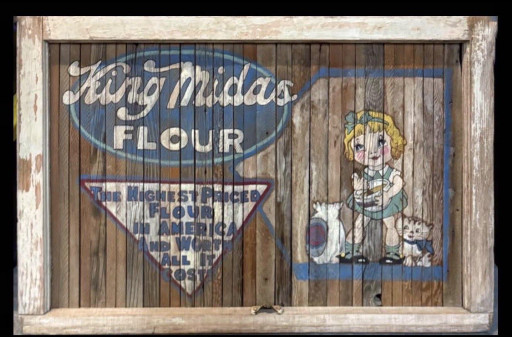 Painted wood advertising sign for King Midas Flour featuring pot scraper illustration