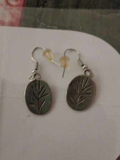 Sterling silver dangle earrings with botanical leaf imprint design