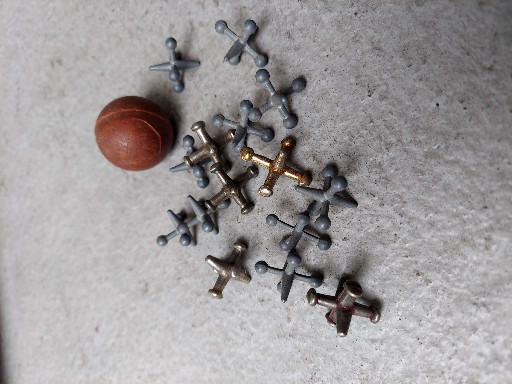 Collection of vintage metal jacks game pieces