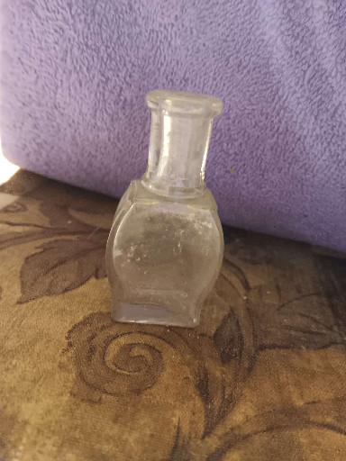 Clear glass perfume or extract bottle, circa early 20th century