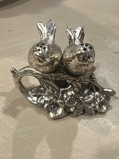 Silver-plated salt and pepper shaker set featuring two birds on a floral branch