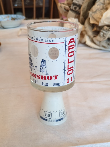 Glass commemorative tumbler titled 'Apollo 11 Moonshot' from 1969