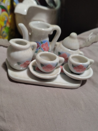 Porcelain miniature tea set with floral decoration for dollhouse or children's play