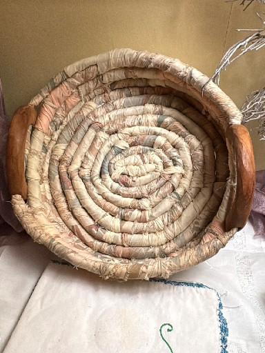 Handwoven coiled basket with wooden handles