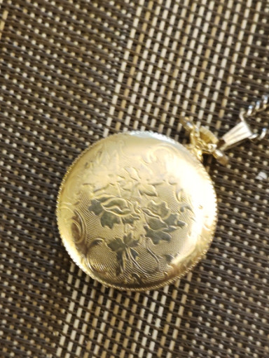 Gold-tone brass pocket watch with floral engraving, Swiss-made movement by Spartein
