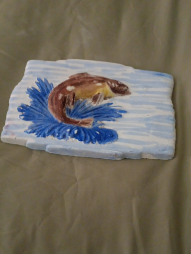 Handmade plaster tile with koi fish relief design
