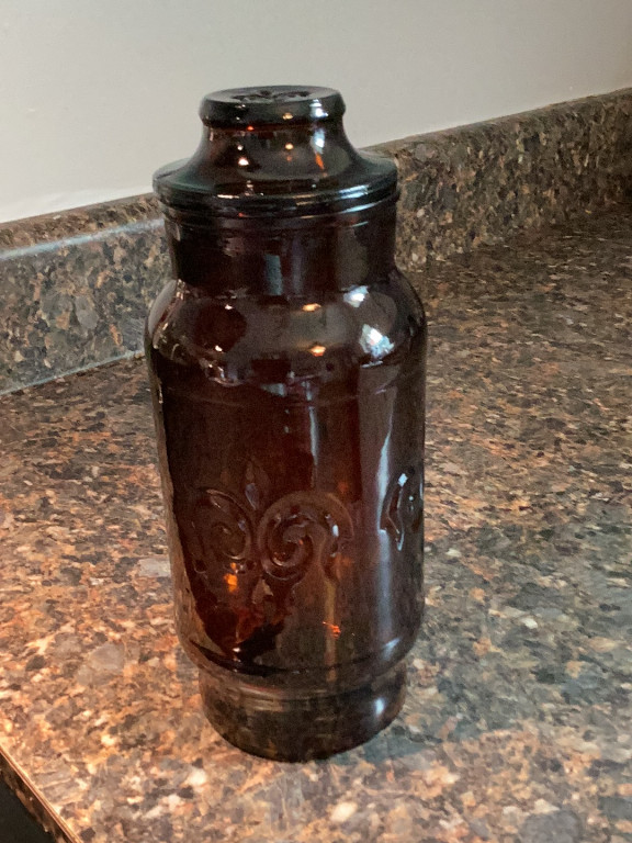 Amber glass canister with Fleur-de-Lis pattern by Borden Cremora
