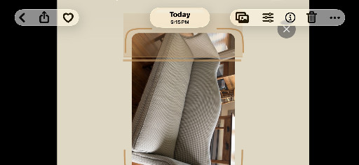 Upholstered wingback armchair with herringbone or houndstooth fabric