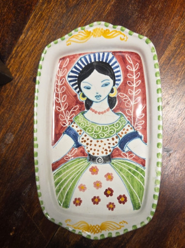 Ceramic decorative platter depicting a woman, designed by Anita Nylund for Jie Gantofta