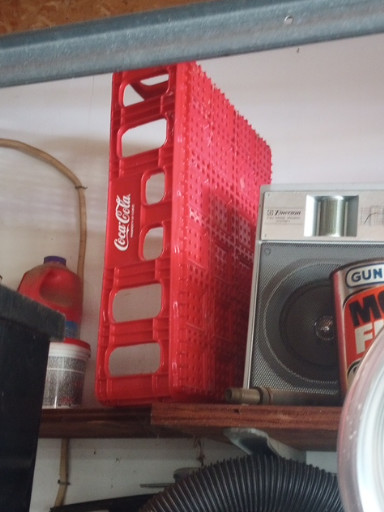 Red plastic Coca-Cola bottle crate