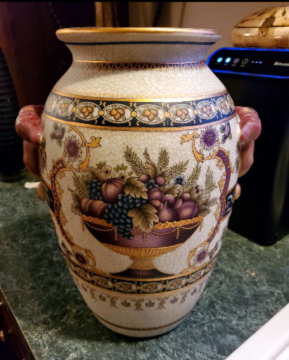 Hand-painted porcelain vase with fruit basket motif and gold gilding