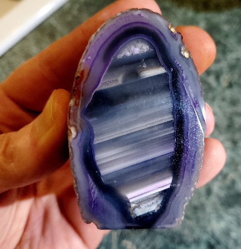 Polished purple banded agate geode slice