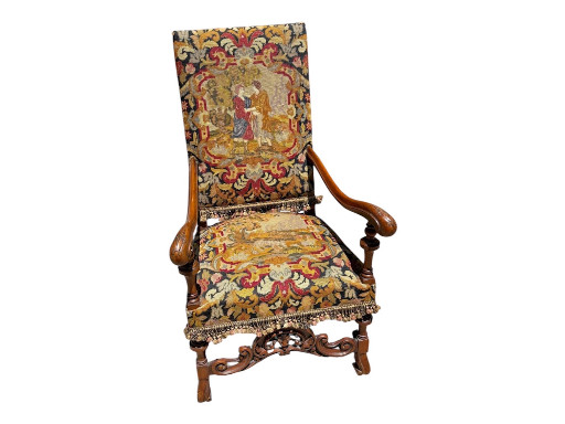 Carved walnut throne chair with needlepoint upholstery depicting biblical scenes