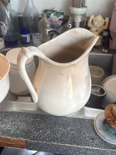 White ironstone pitcher with crazing and staining, circa late 19th to early 20th century