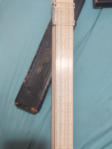 Vintage slide rule with leather case, circa 1950s–1960s