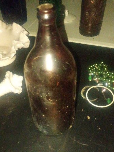 Amber glass beer bottle, circa 1890s–1950s