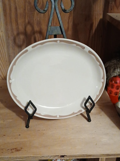 Ceramic oval platter with brown scroll border pattern, likely Buffalo China Restaurant Ware. We have two of these available
