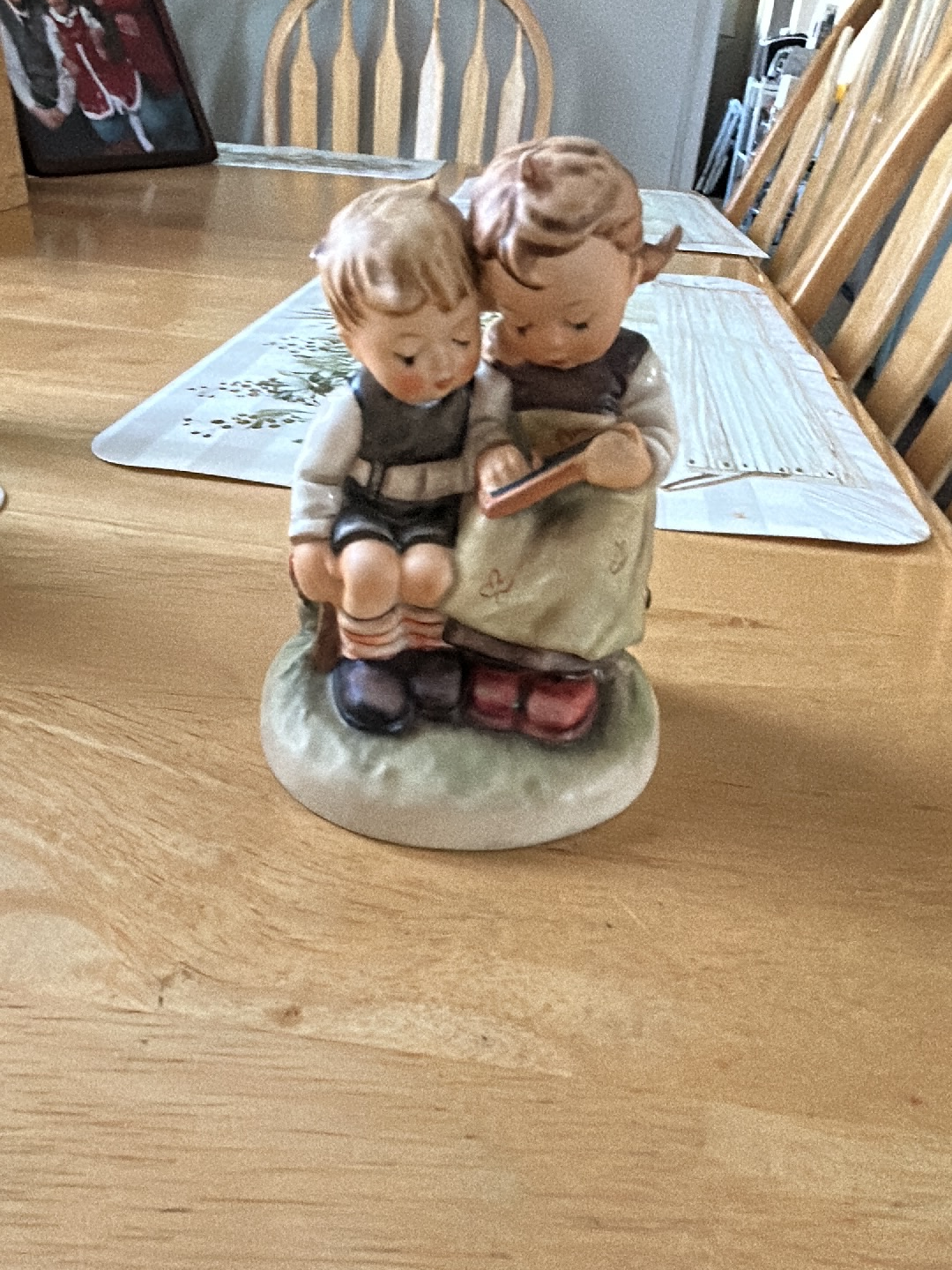 Porcelain figurine titled 'Smart Little Sister' by Goebel Hummel