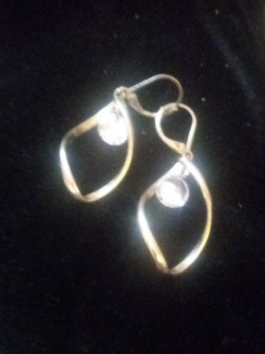 Sterling silver dangle earrings with twisted design and pearl accents