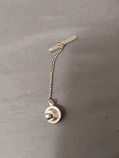 Silver-tone tie tack with circular decorative element