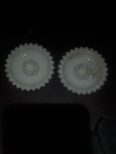 Milk glass candlestick holders with sunflower pattern by Hazel Atlas