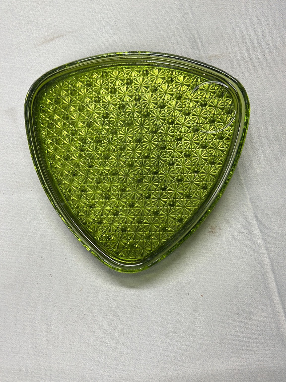 Pressed glass triangular snack plate in avocado green with 'Daisy and Button' pattern by Indiana Glass Company or Lancaster Glass Company