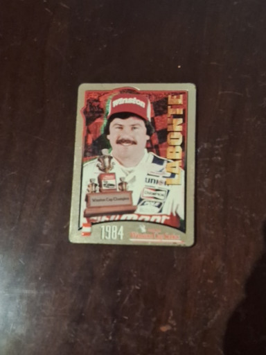 Metal trading card featuring Dale Earnhardt from the NASCAR Winston Cup 25th Anniversary series (1984)