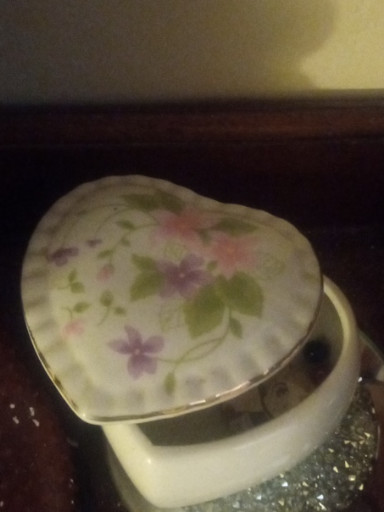 Porcelain heart-shaped trinket box with floral decoration and gold trim by Brinns