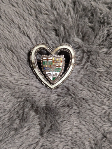 Sterling silver heart-shaped brooch with enamel coat of arms