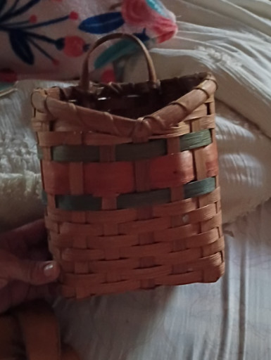 Woven ash splint basket with bentwood handle and decorative colored bands