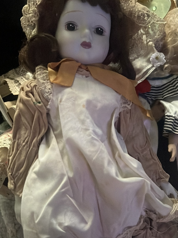 Porcelain bride doll with lace and satin dress