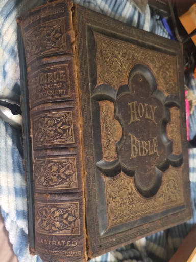 Leather-bound illustrated 'Holy Bible' with metal clasps, circa 1880s
