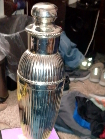 Silver-plated Art Deco cocktail shaker with fluted body and built-in strainer
