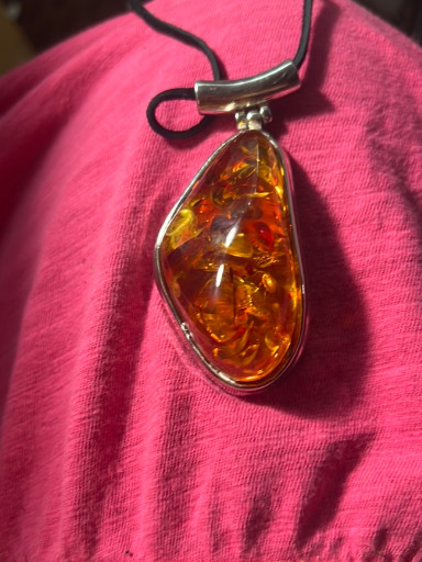Sterling silver pendant with Baltic amber cabochon