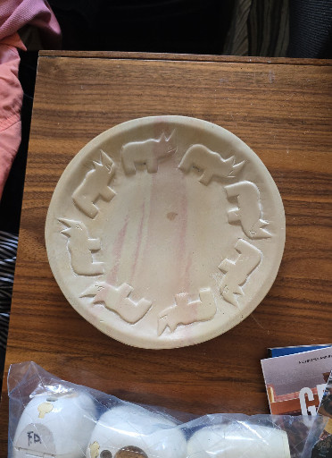 Hand-carved ceramic pottery featuring rhinoceros motif from Kenya