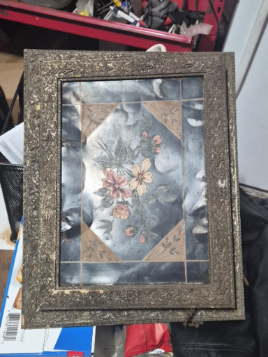 Framed decorative floral print with ornate gold-tone frame