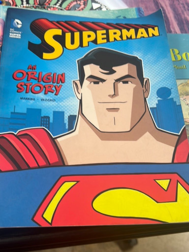 Paperback book titled 'Superman: An Origin Story' by Matthew K. Manning, published by DC Comics