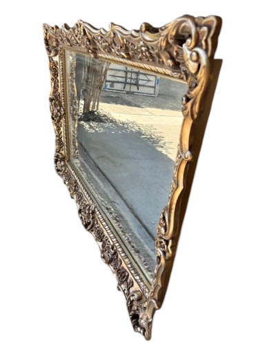 Ornate gilt wood and gesso wall mirror with Rococo Revival styling