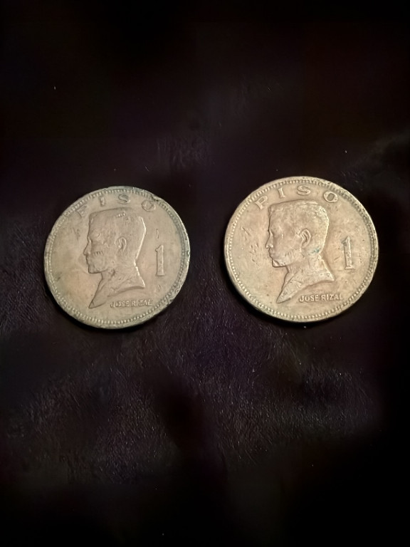 Two copper-nickel-zinc 1 Piso coins from the Philippines featuring Jose Rizal