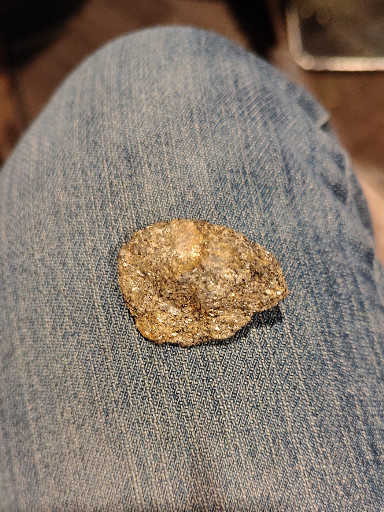 Natural mineral specimen, possibly a geode fragment or botryoidal quartz/limonite concretion