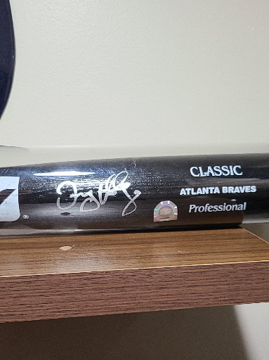 Signed Louisville Slugger Professional baseball bat by Atlanta Braves player